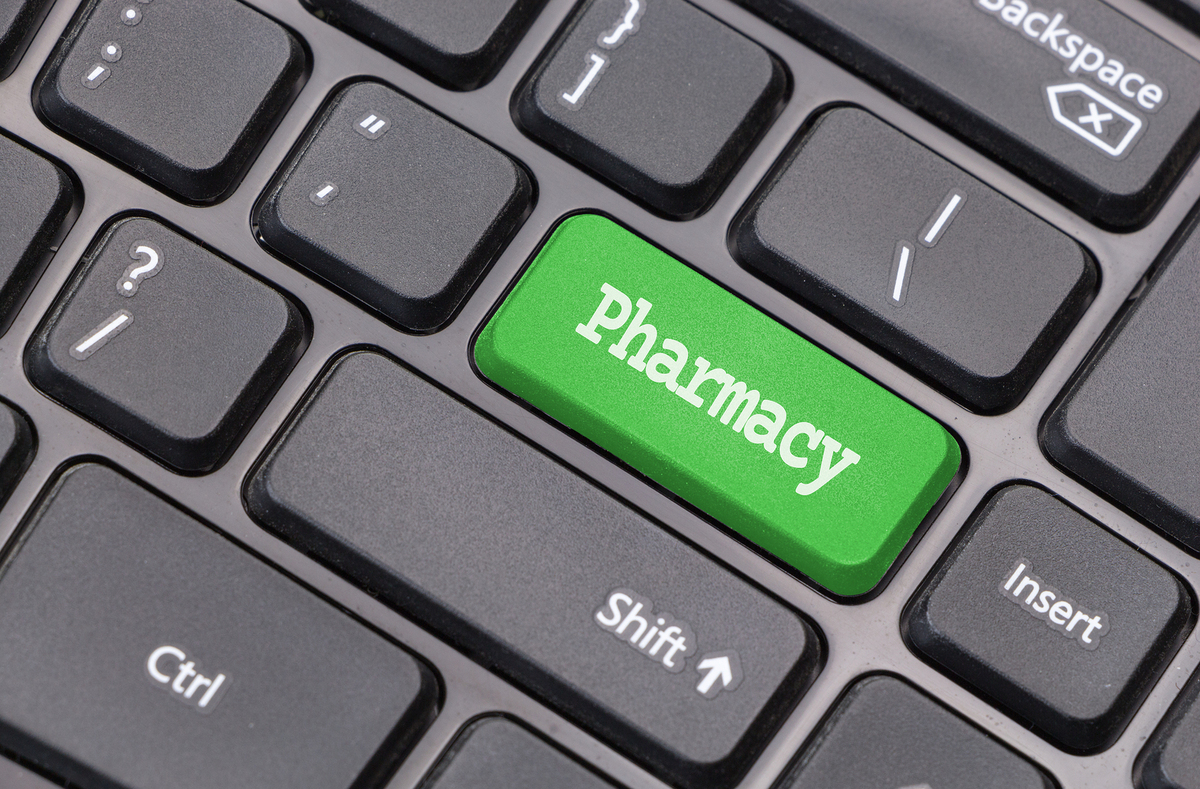 Computer keyboard with enter key labeled pharmacy.