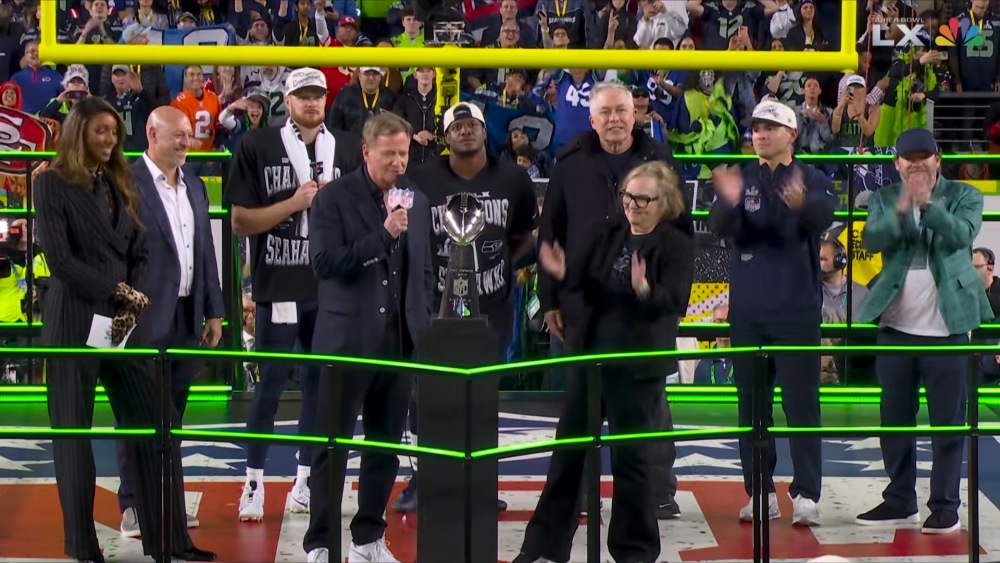 Seattle Seahawks celebrating with Lombardi Trophy on field ceremony.