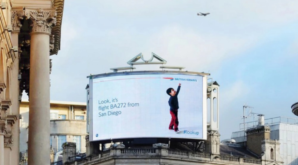 British Airways #lookup billboard child pointing at real plane overhead