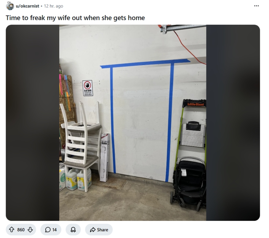 Fake Backrooms door outlined in blue tape on a garage wall