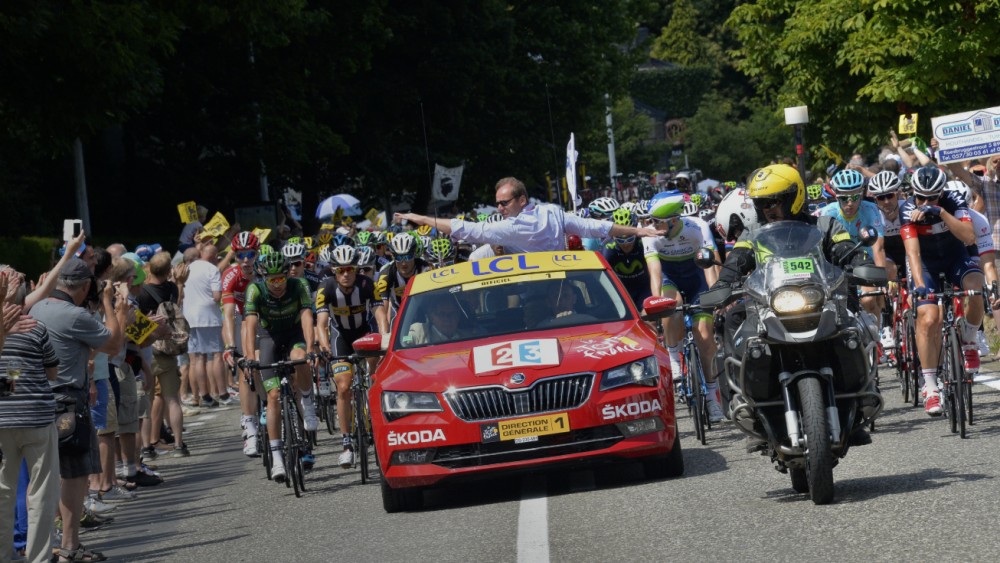Tour de France race director leads peloton from official car