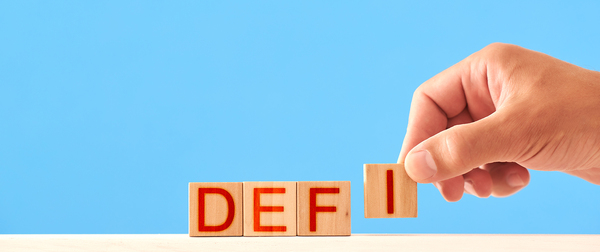 DEFI letters on wooden blocks.