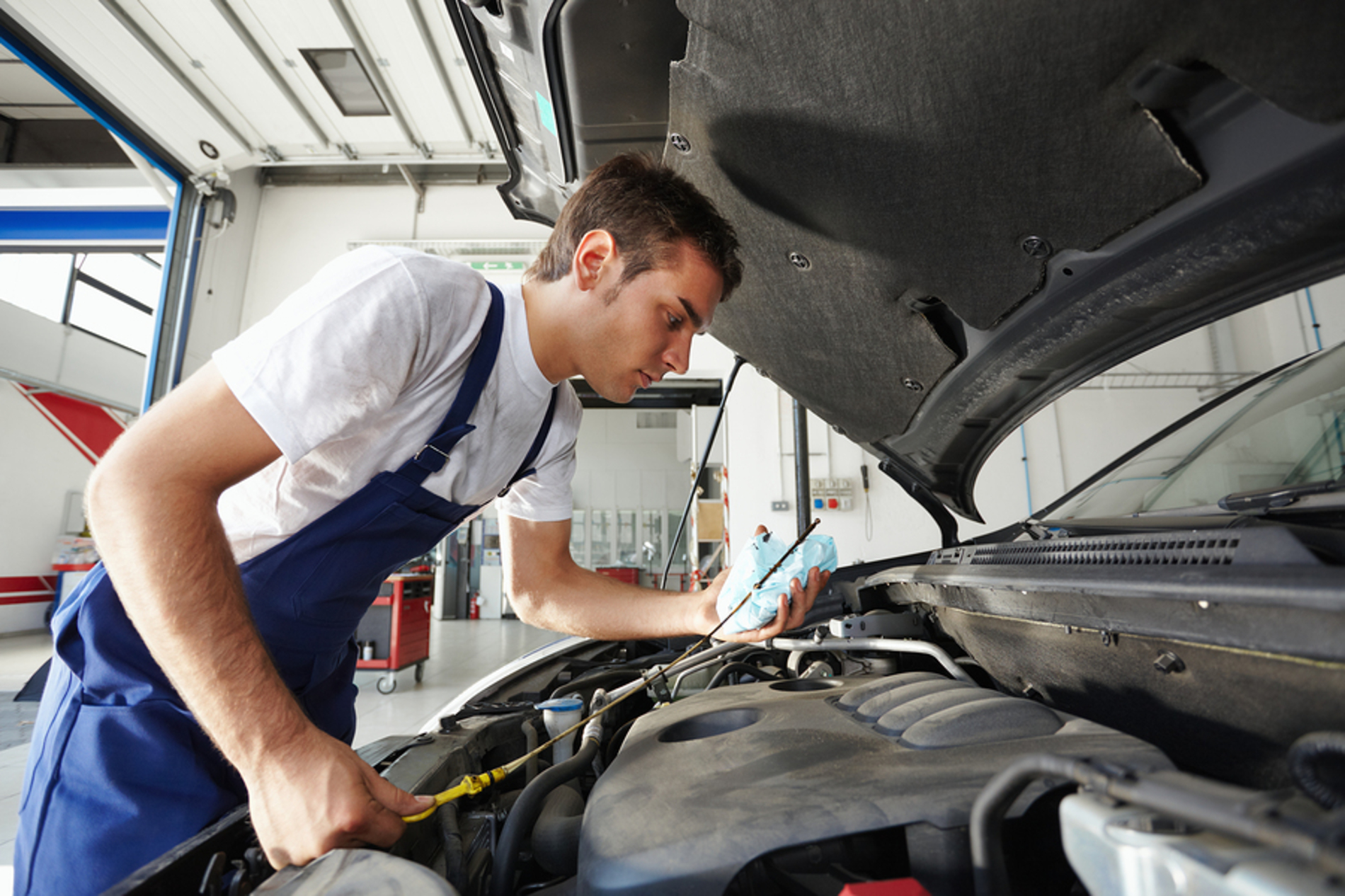 Mechanic working on an engine.