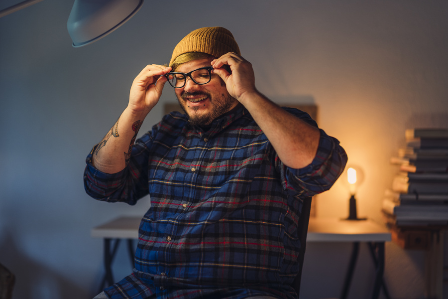 Person putting eye glasses on.