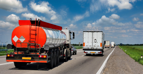 Trucks driving on a highway.