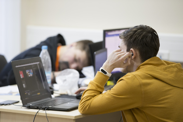 Computer worker falling asleep on their desk.