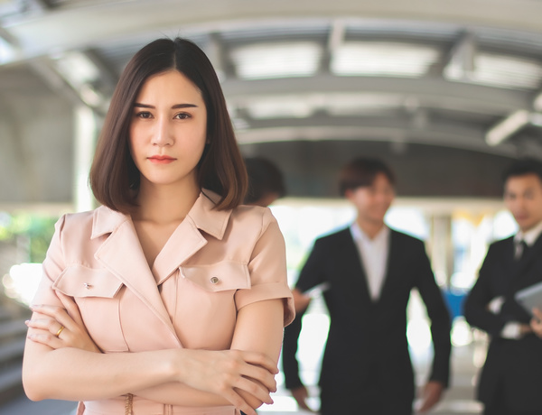 Woman standing with her arms crossed.