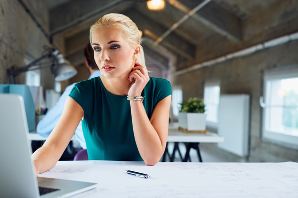 Woman working at a table. Data enrichment tools