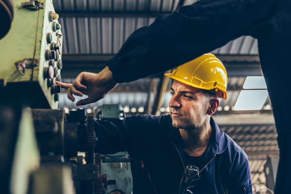 Field service team working on machinery.