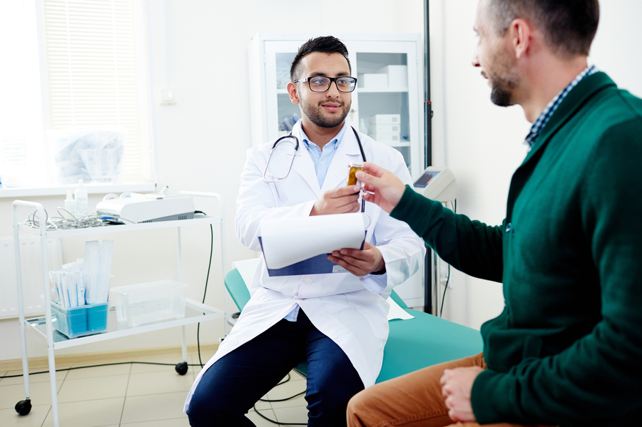 Man having a discussion with his medical doctor.