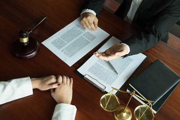 Two people discussing a document.