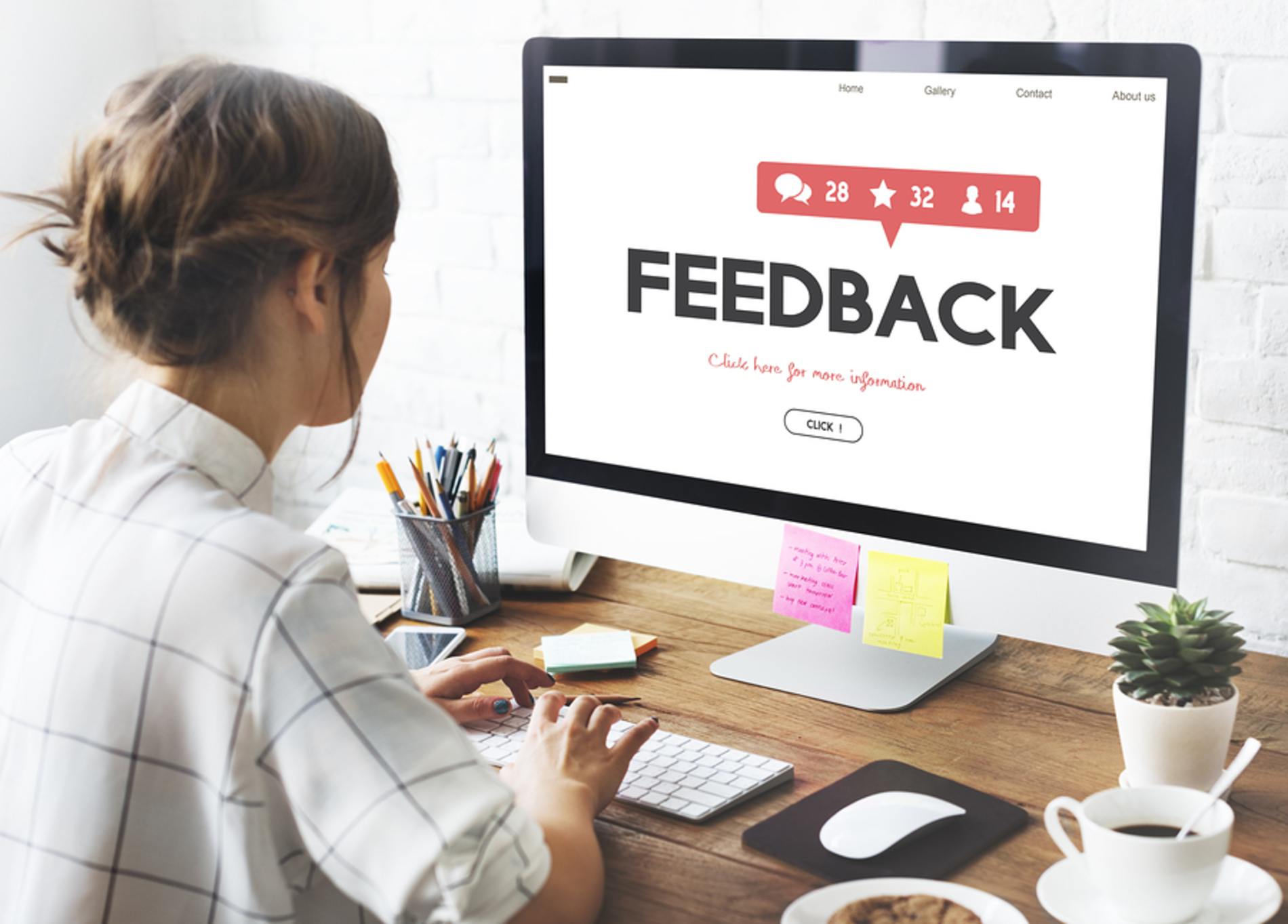 Woman leaving feedback on her desktop computer. Woman leaving feedback on her desktop computer.