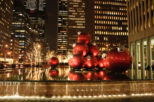 City view with large Christmas balls on display.