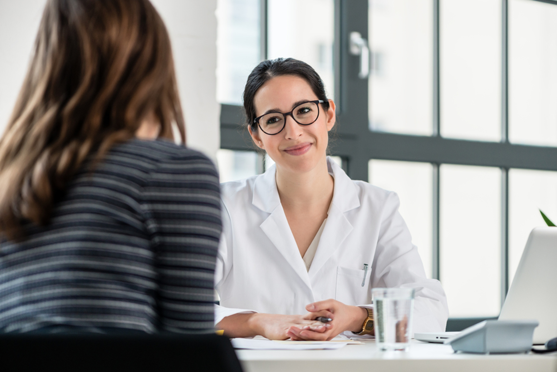 Medical doctor speaking with a patient.