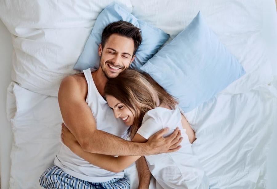 Couple snuggling together.