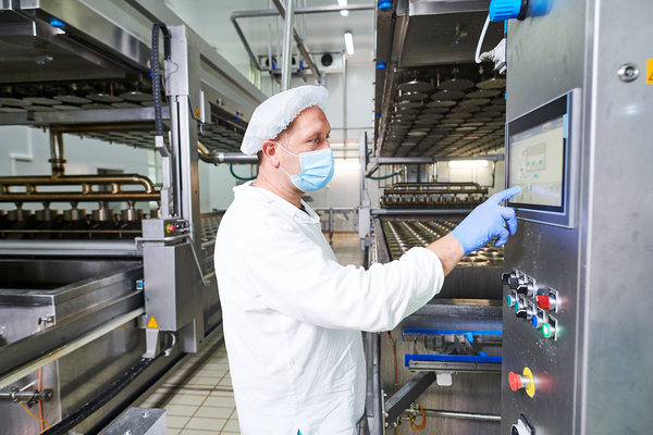 Technician typing in a control box.