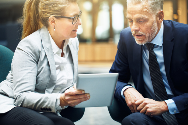 Two people having a discussion - cloud environment