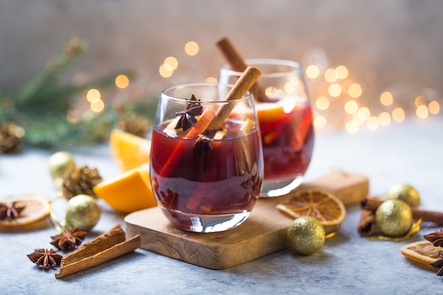 Two glasses of a red beverage.