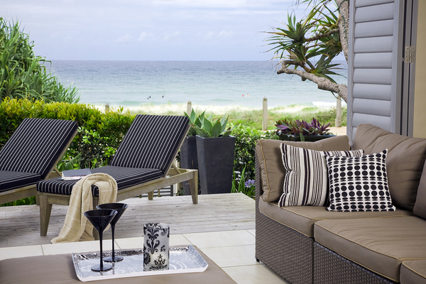 Outside deck with lounge chairs and couch.