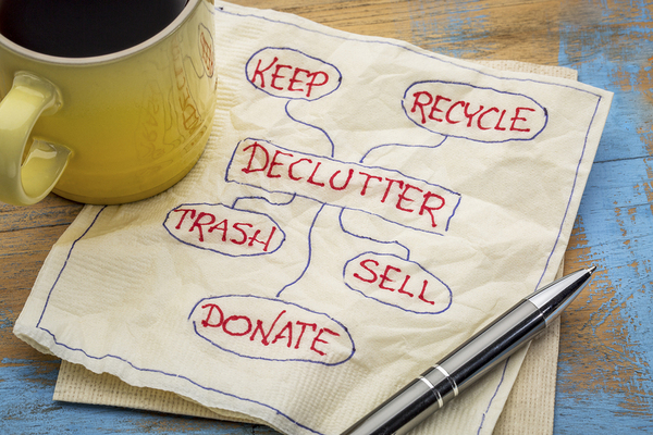 Napkin with notes, declutter, keep, recycle, trash, sell, and donate.
