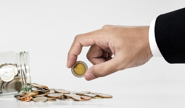 Person holding a coin.