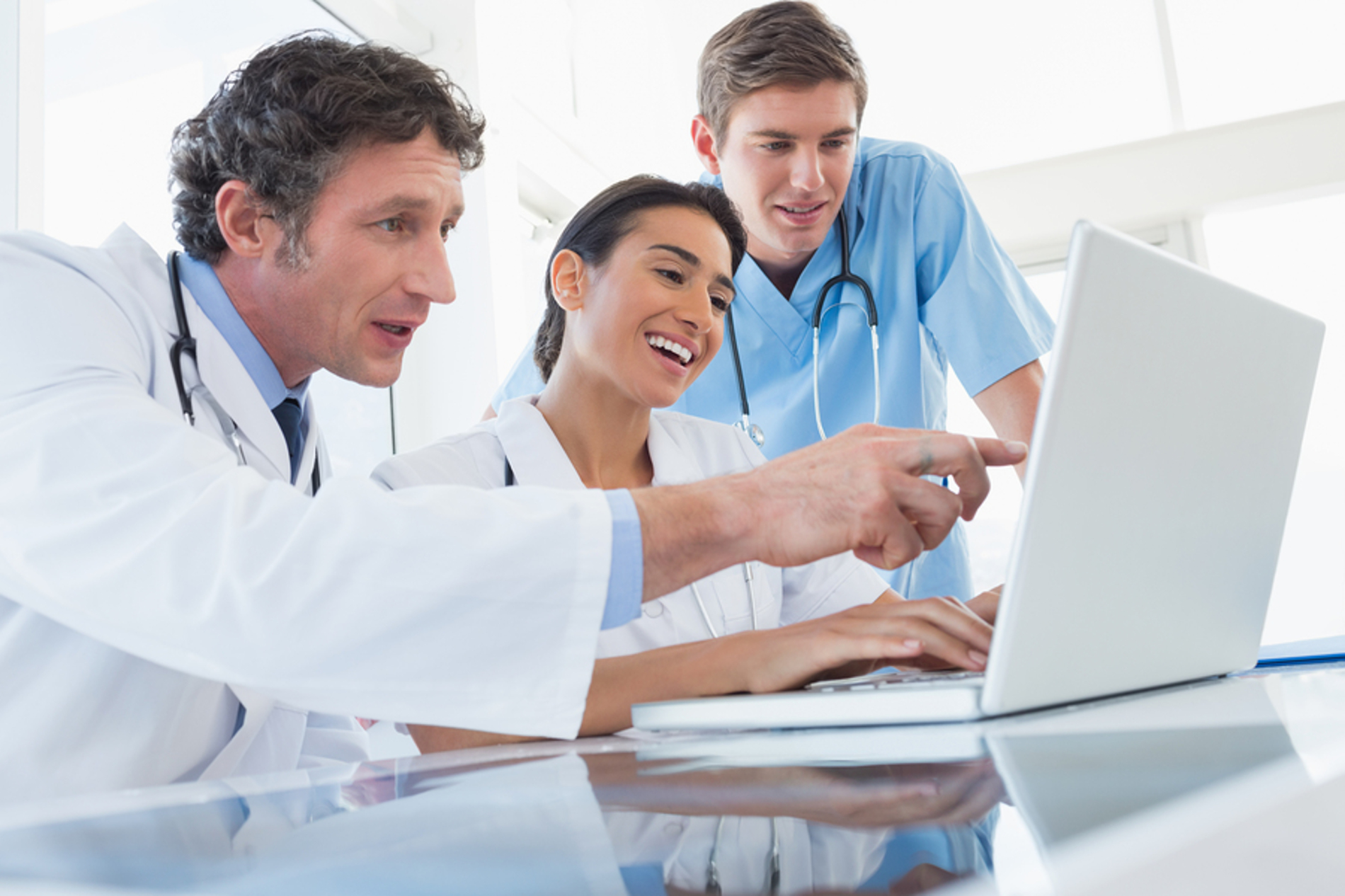 Three medical doctors discussing a case.