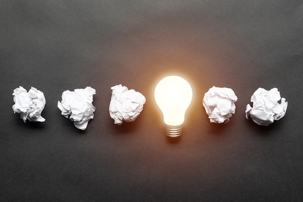 Crumpled up paper and lightbulb.