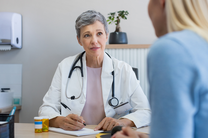 Medical doctor interviewing patient.