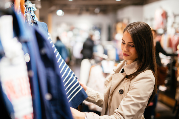 Woman shopping for clothing.