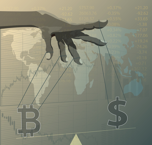 Hand with strings attached to a bitcoin symbol and dollar sign symbol.