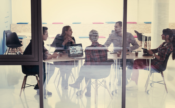 Group meeting around a table.