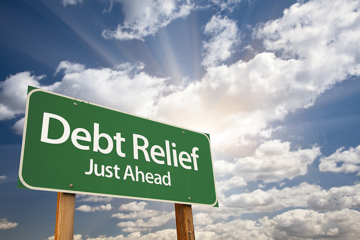 Debt relief just ahead road sign.