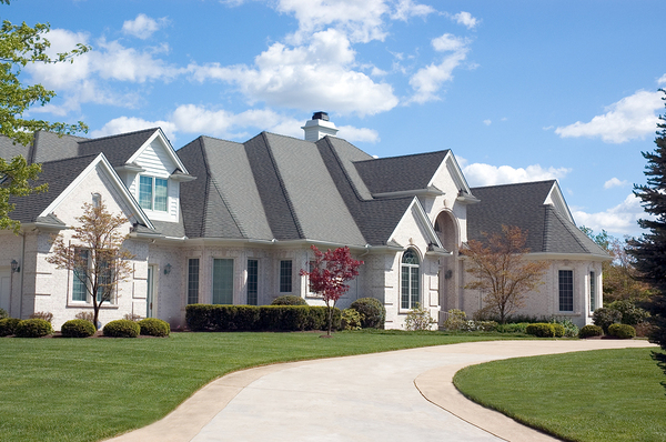 White home with grey roof and white gutters.
