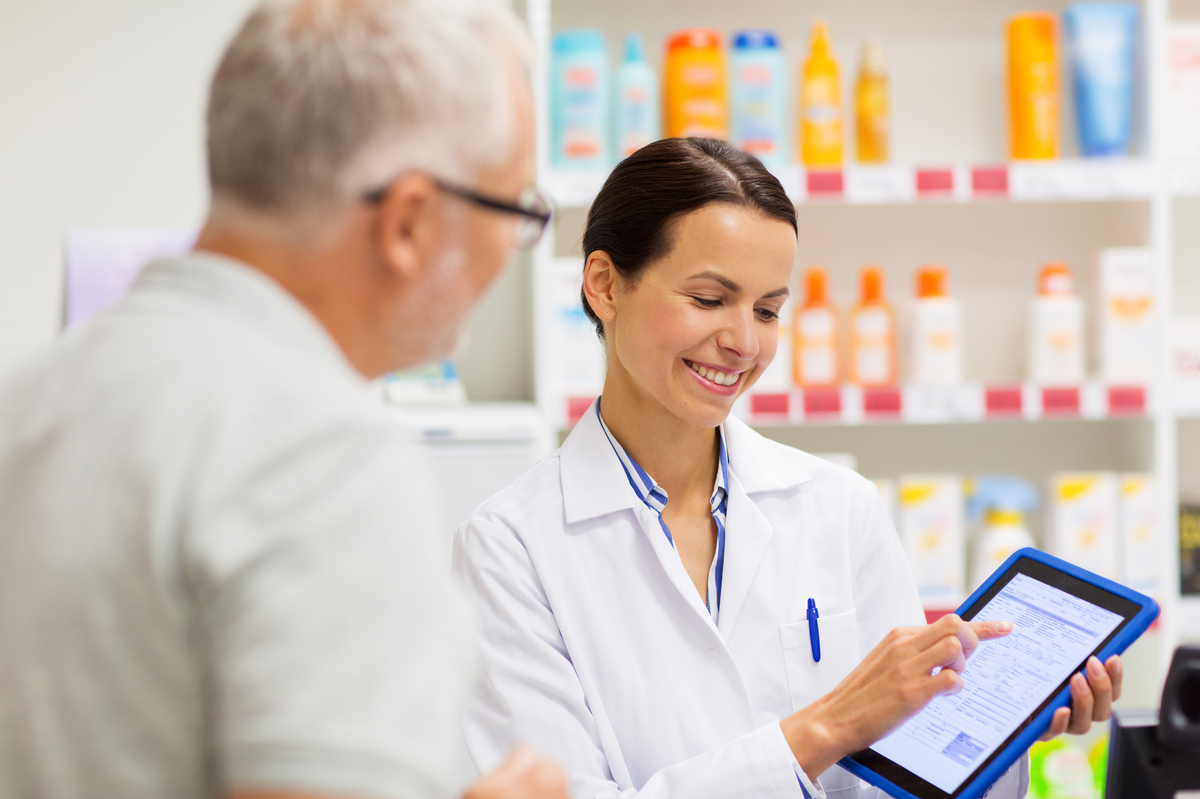 Pharmacist answering a man's questions.