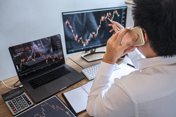 Looking at graphs on a computer monitor.