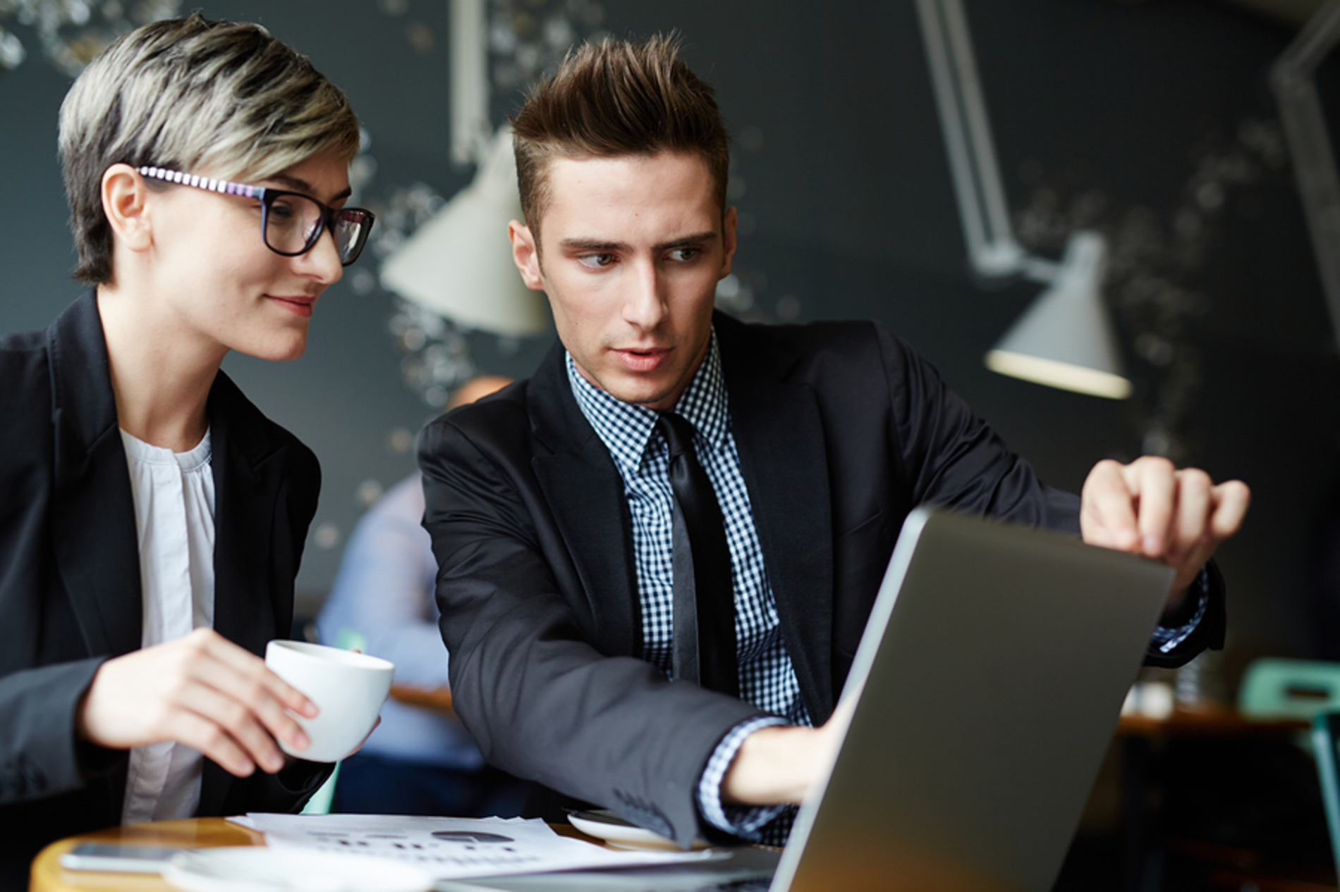 Two workers discussing a project.