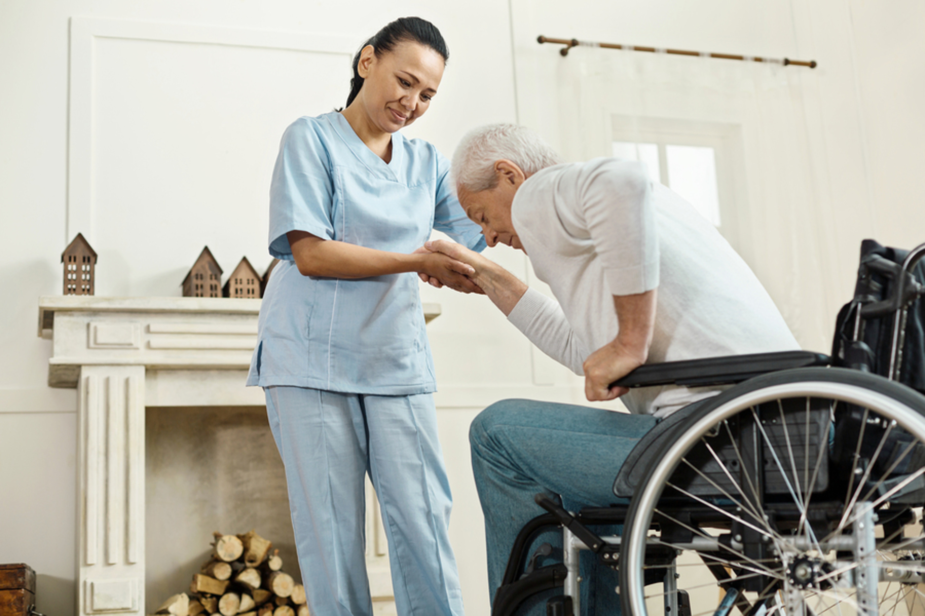 Assistant helping an elderly man stand up. Assistant helping an elderly man stand up.