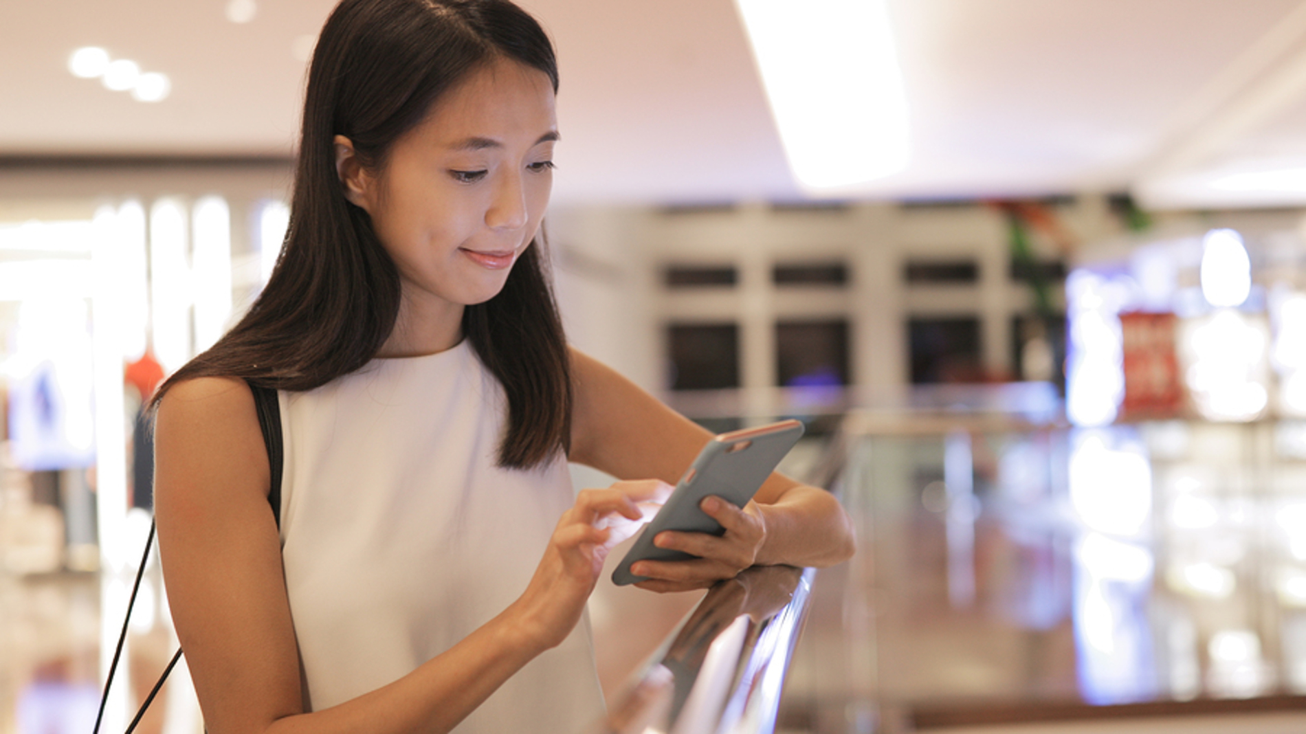 Woman typing on her mobile phone.