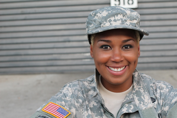 Woman wearing an military uniform.