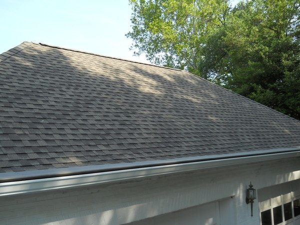 Shingled roof over a garage.