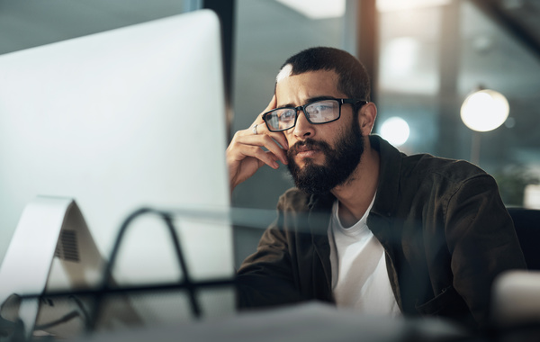 Working at a desktop computer. mainframe software