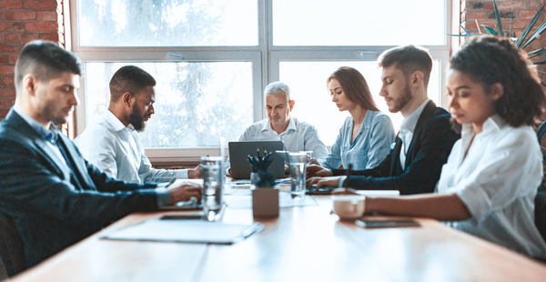 Group meeting around a table. data-driven decision