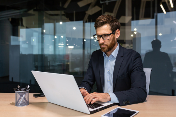 Typing on a laptop. Digital modernization