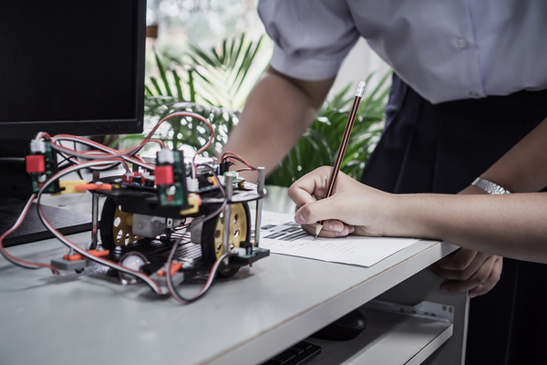 Person working on a robot.