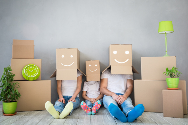 Family with boxes over their heads.