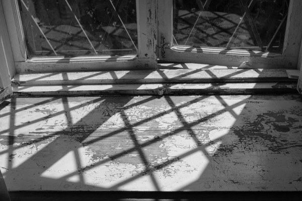 Window sill with faded paint.