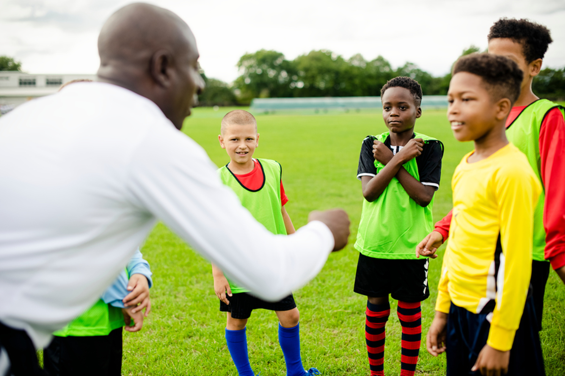 Group of kids playing soccer.