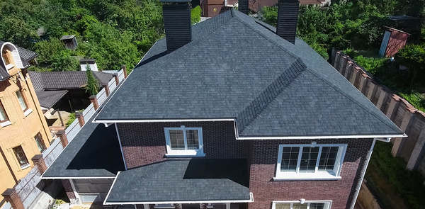 House with singled roof and white gutters.