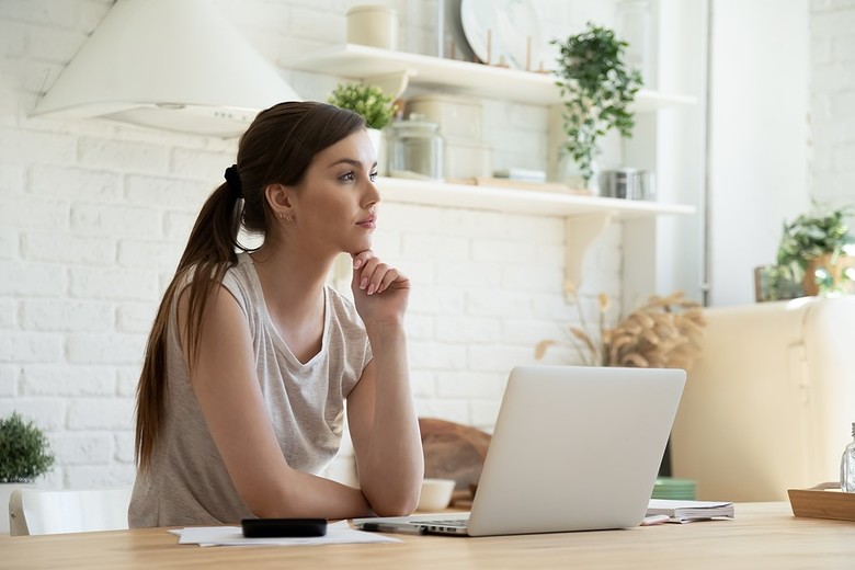 Woman sitting at her desk.