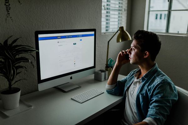 Man looking at his computer screen.